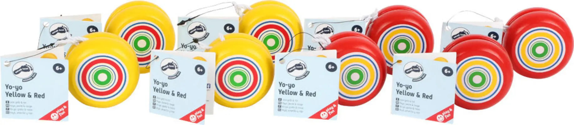 Image de plusieurs yoyos de différentes couleurs alignés sur une table en bois